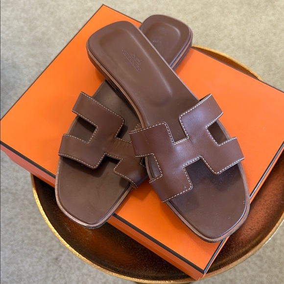 Hermes Oran Gold Sandals - Picture 1 of 6